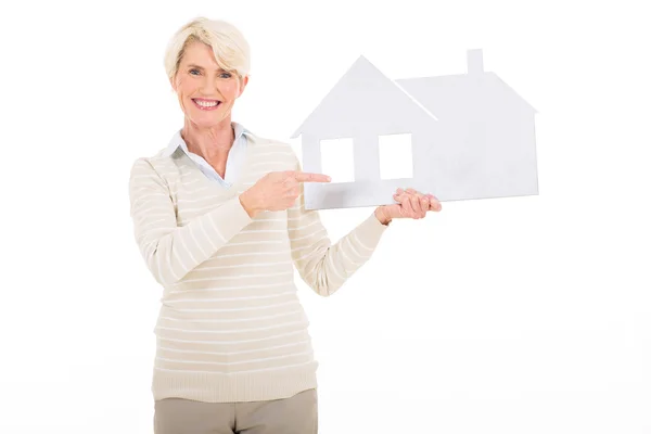 Woman pointing paper house — Stock Photo, Image