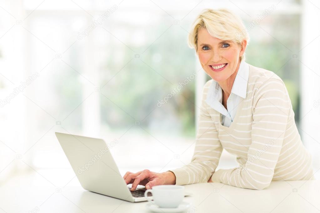 Middle aged woman using computer