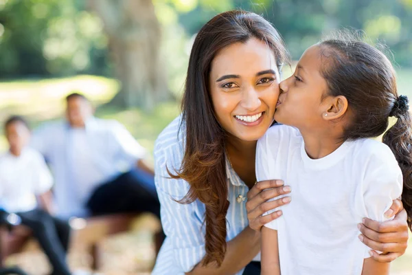 Little indian girl kissing mother — Stock Photo, Image