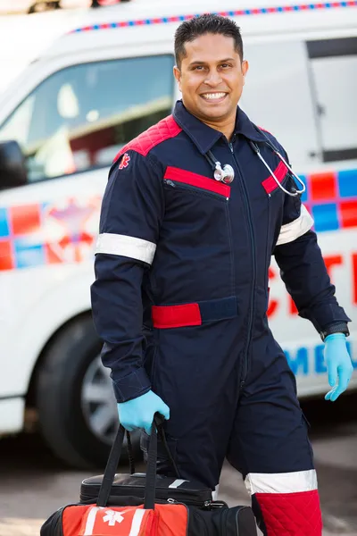 Paramedic carrying portable equipment — Stock Photo, Image