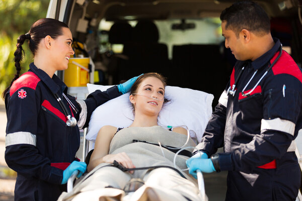 Paramedic comforting patient