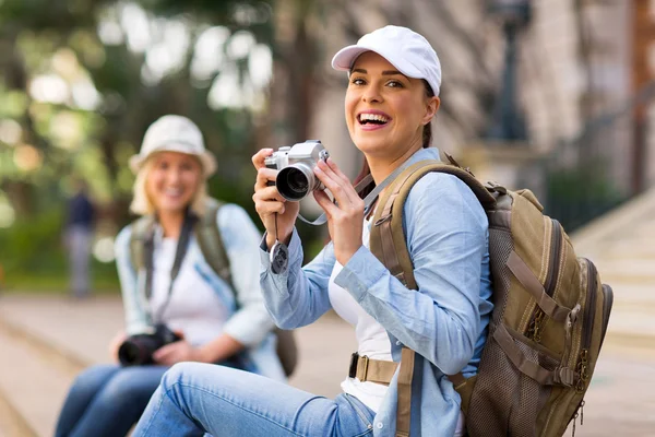 Cheerful tourist holding camera — Stock Photo, Image