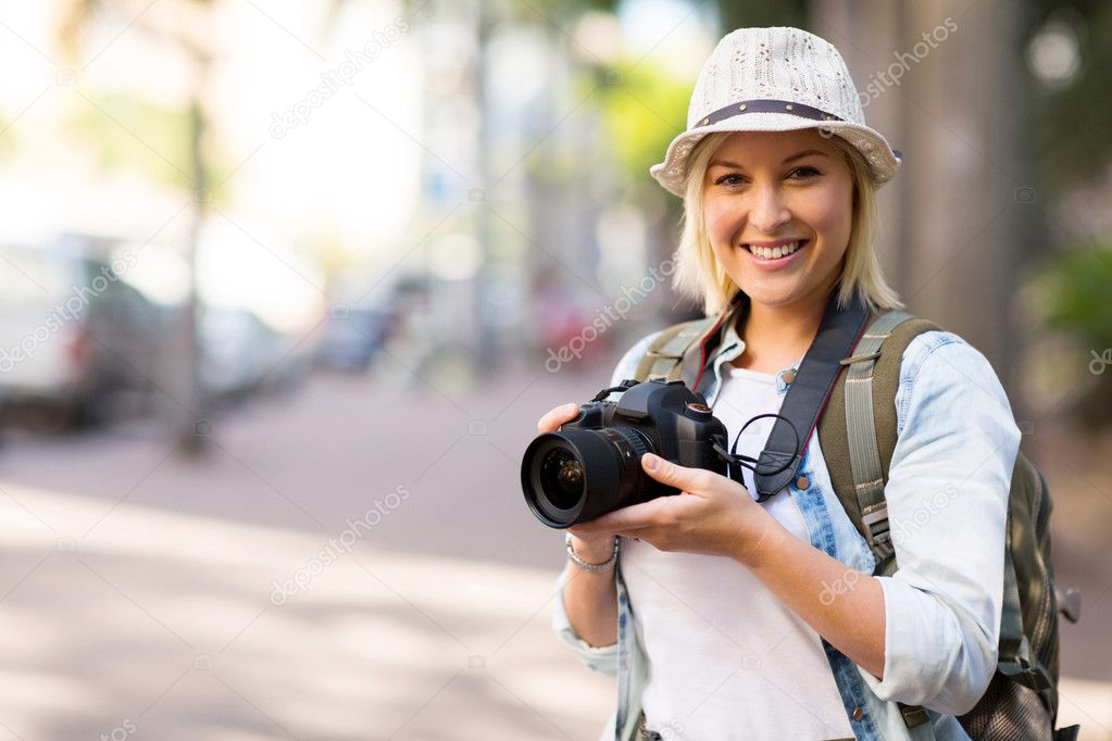 Tourist holding camera