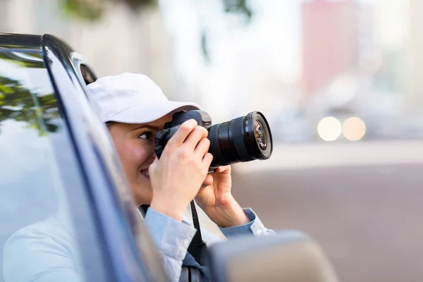 Girl taking picture with camera — Stock Photo, Image