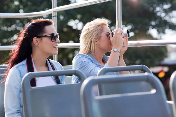 Tourists taking pictures from bus — Stock Photo, Image