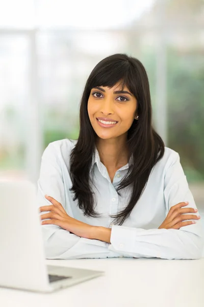 Indian businesswoman relaxing in office — Stock Photo, Image