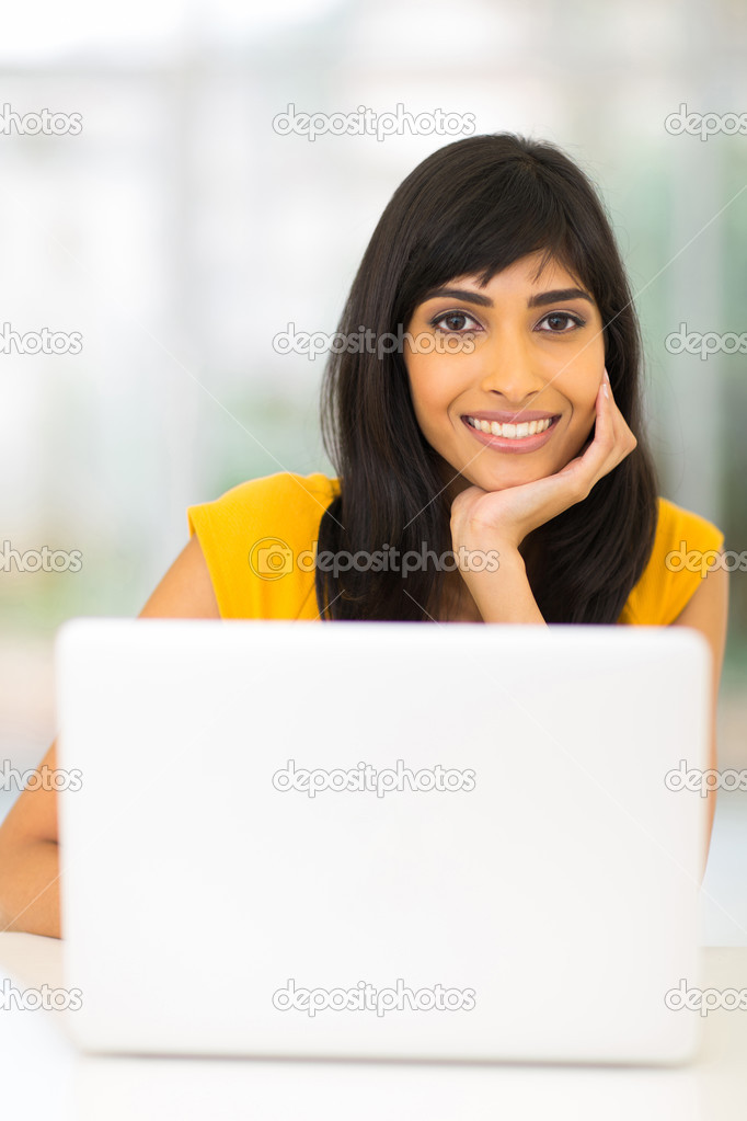 Indian woman in front of laptop