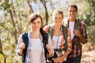 group of friends hiking in autumn mountain clipart