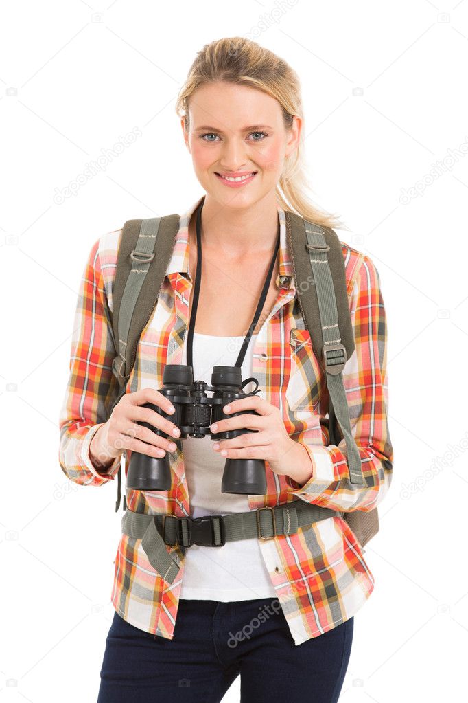 female hiker holding binoculars