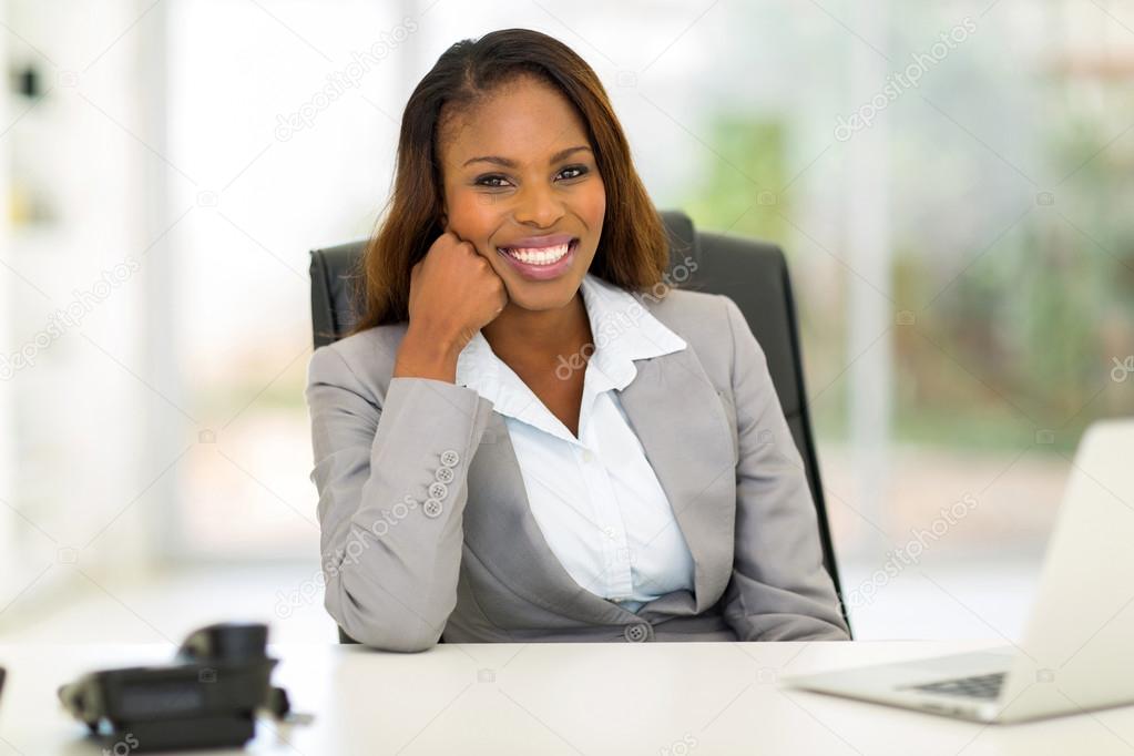 young african businesswoman sitting in office