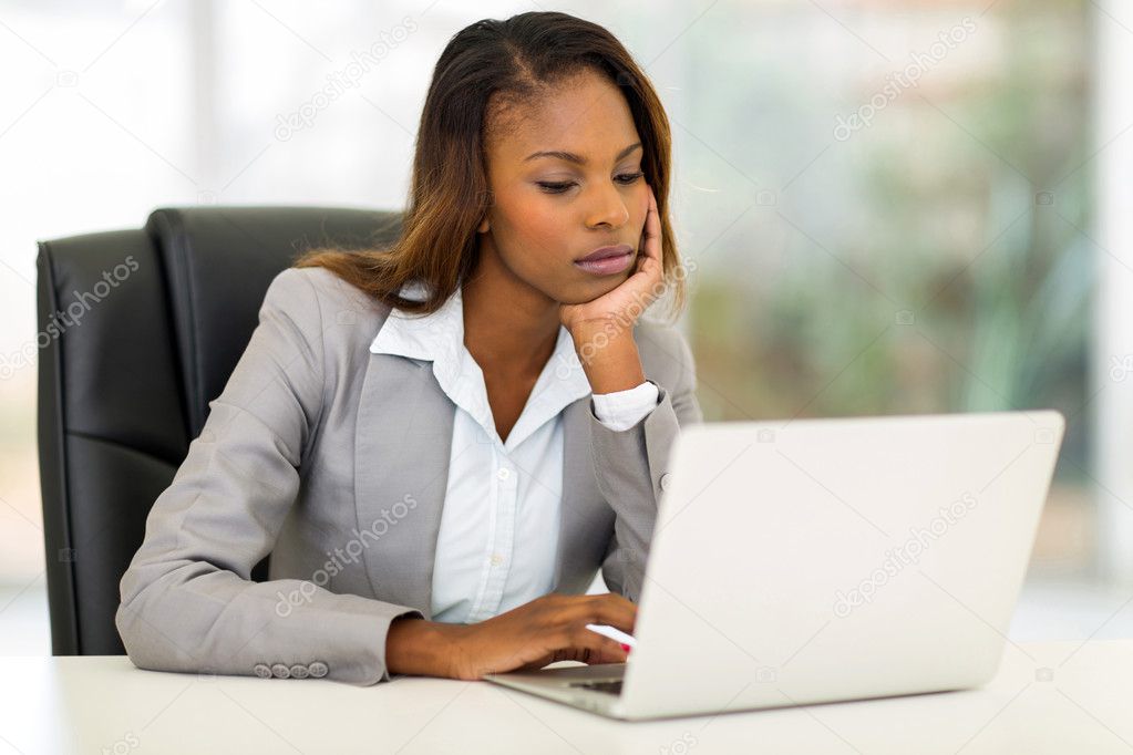 young african businesswoman looking at the laptop screen