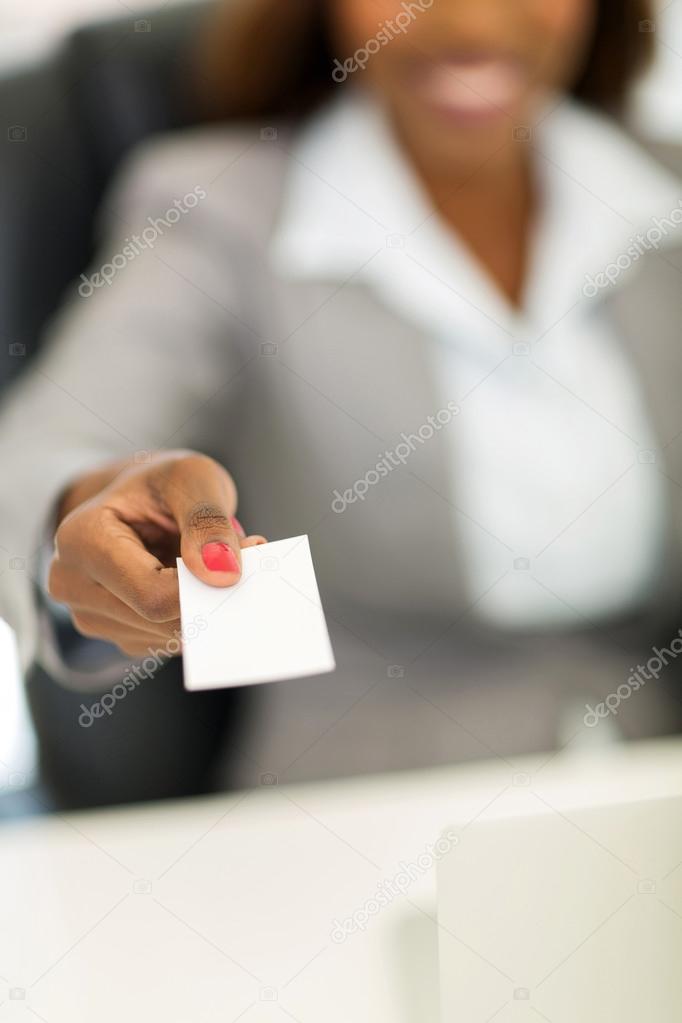 african american businesswoman handing business card