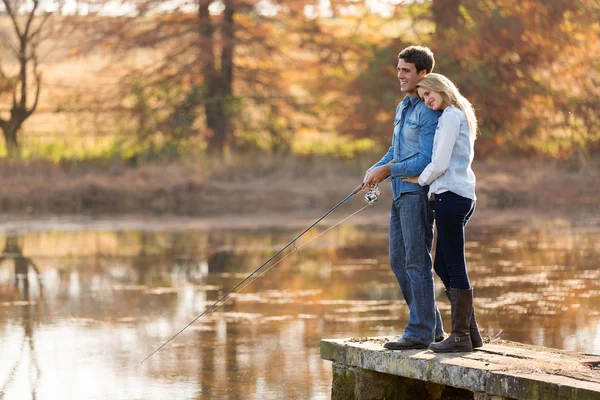 Young couple fishing together — Stock Photo, Image