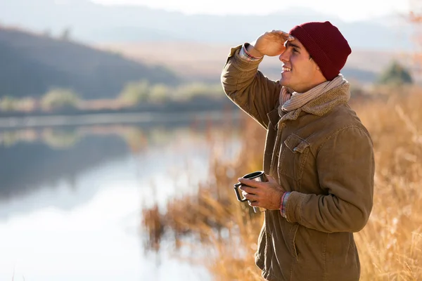 Young man looking into distance — Stock Photo, Image