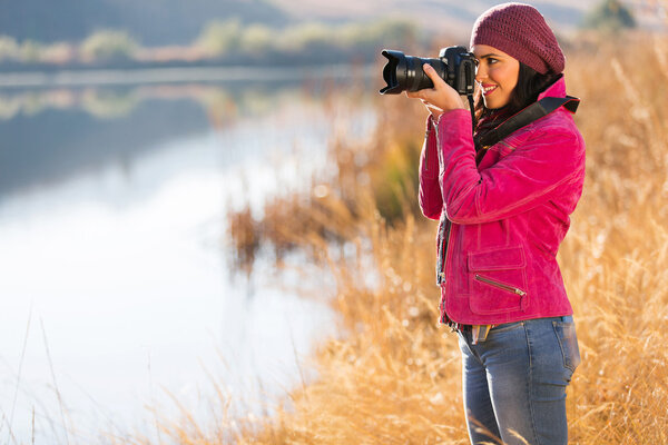 Photographer take photos outdoors in autumn