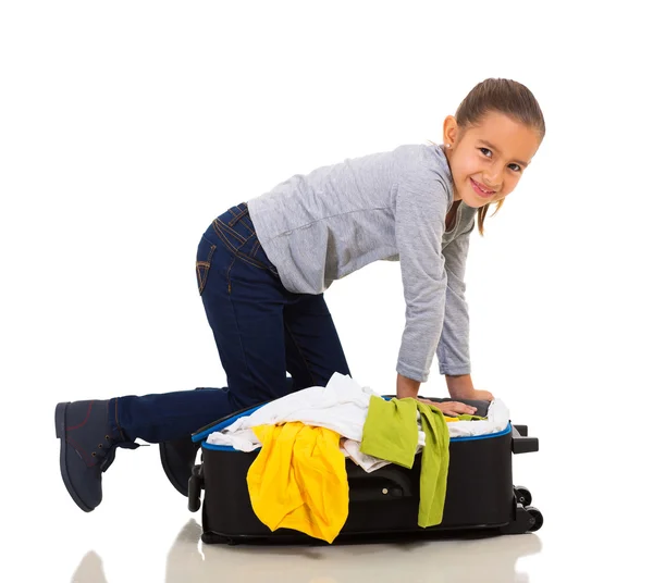 Girl packing suitcase — Stock Photo, Image