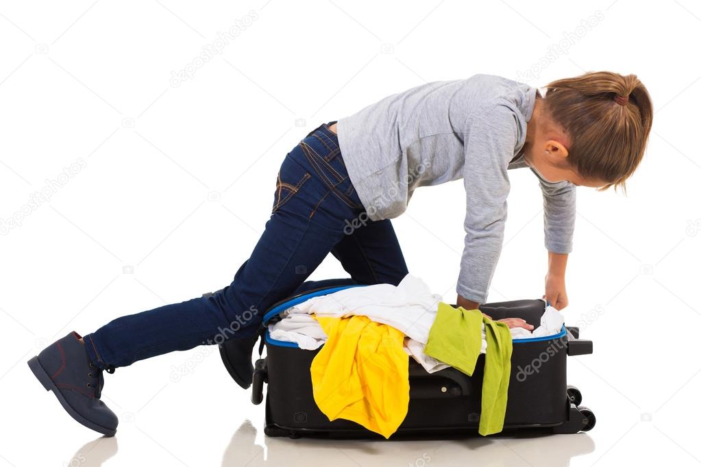 Girl packing suitcase