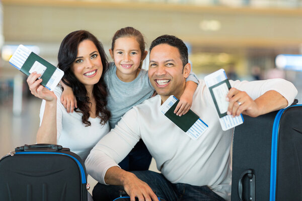 Family holding boarding pass