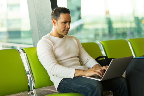 Middle aged man using laptop