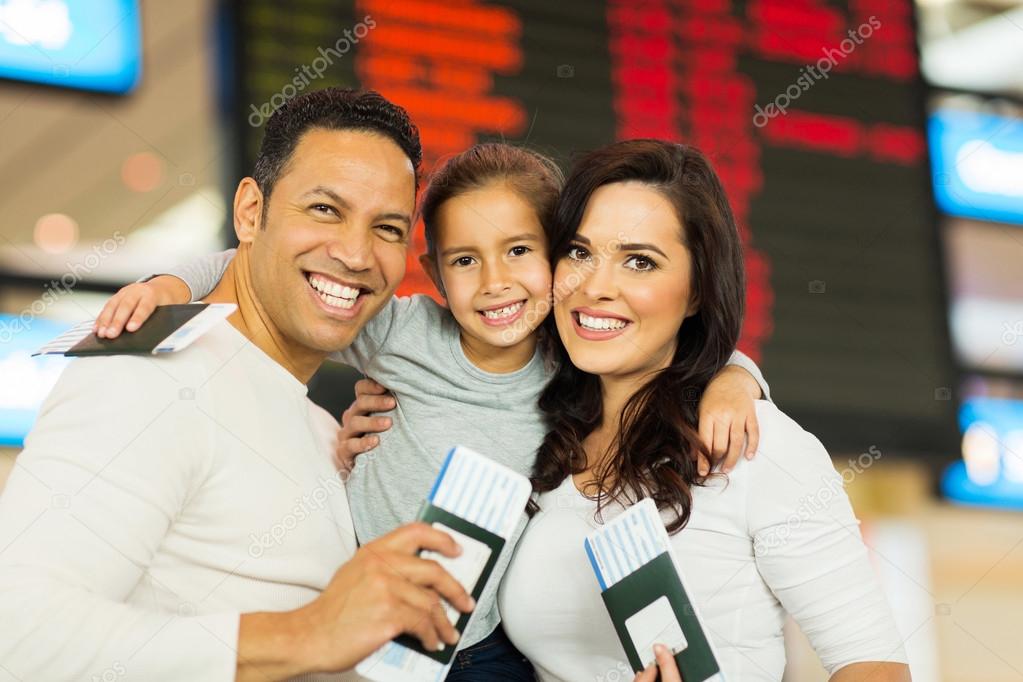 Family holding passports