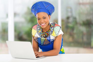 African woman using laptop clipart