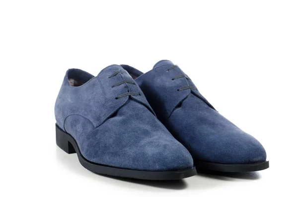 Everyday pair of blue men 's shoes on a white background — стоковое фото