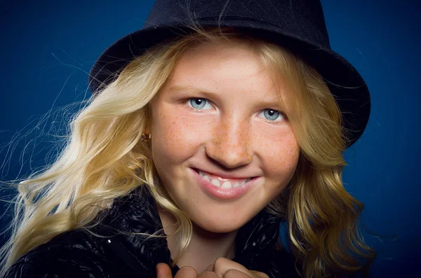 Girl laughing, holding the jacket, and looking at the camera — Stock Photo, Image