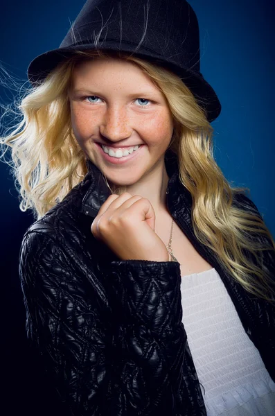 Girl laughing, holding the jacket, and looking at the camera — Stock Photo, Image