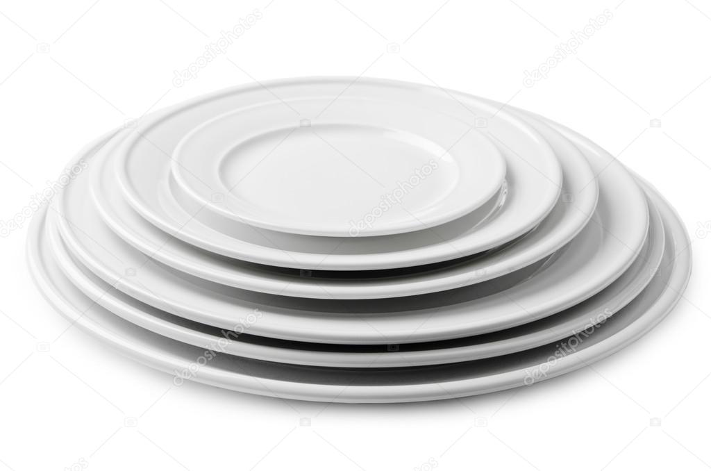 A stack of blank white plates of different sizes