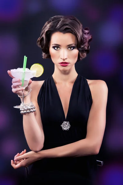 Beautiful elegant girl with a martini glass — Stock Photo, Image