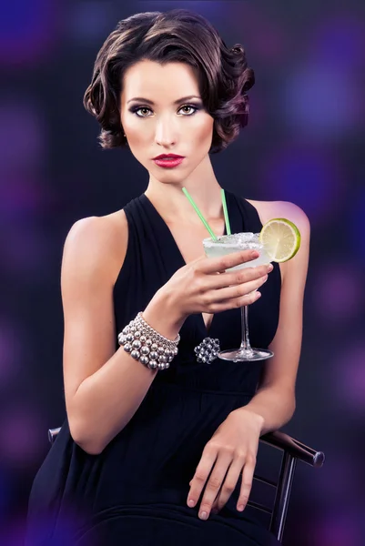 Beautiful elegant girl with a martini glass — Stock Photo, Image