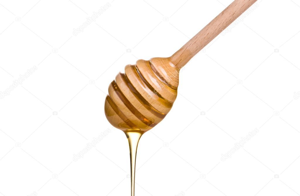 honey is dripping from the spoon