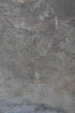 Doku, eski duvarın arka planı, soyulmuş alçı, renkli lekeler, sıyrıklar, onarılması gerekiyor. Mantar, küf ve yüksek nem yüzünden yok olmuş..