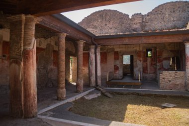 Archaeological park of Pompeii. An ancient city that tragically perished under lava. Old dilapidated houses, villas. Internal Italian courtyards. Walks in the historical places of Europe