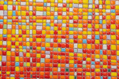 Abstract ceramic background. Italian traditional patterns on tiles, handmade craft painting - squares, yellow and red colors. Amalfi coast.