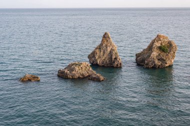 I Due Fratelli ( Two brothers) are a group of rocks located in the municipality of Vietri sul Mare, in the province of Salerno. Calm seascape at sunset