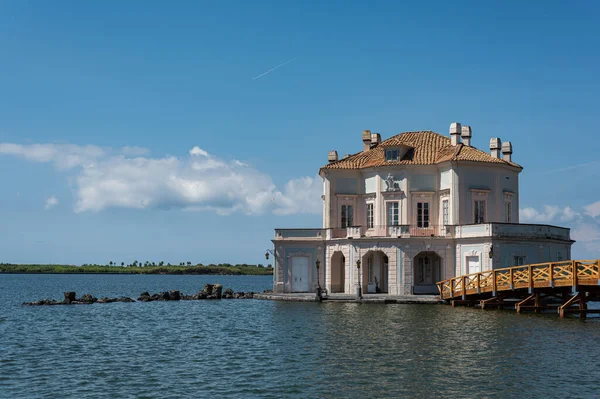 Casina Vanvitelliana. Luxurious Italian villa in the baroque style. House on the water. A hunting lodge located on an islet of Lake Fusaro, in the municipality of Bacoli in the city of Baia.