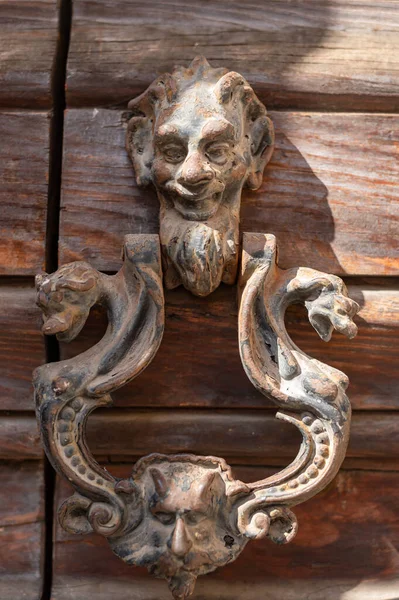 Italian Metal Brass Doorknob Strange Scary Face Wooden Door — стокове фото