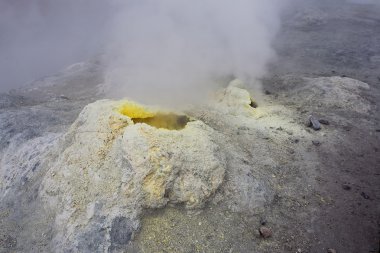 Sulfur fumarole in active volcanic crater clipart