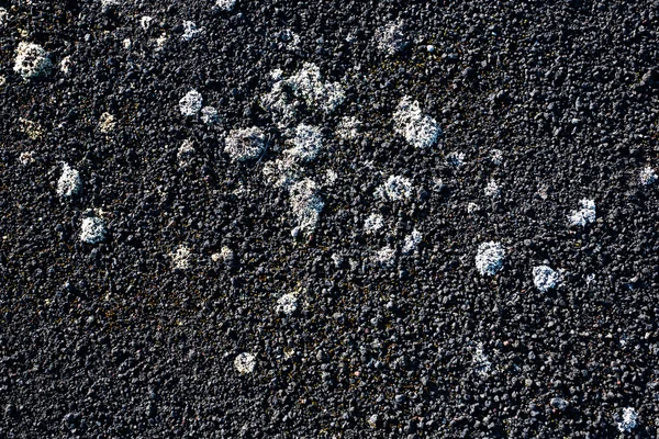 Tierra volcánica con textura de fondo negro . — Foto de Stock