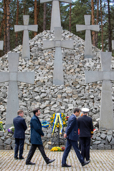 Bykivnia, Ukraine  May 15, 2022: The ceremony of Ukrainian and Polish delegations of honoring the memory of victims of Stalinist repressions at the Polish military cemetery in Bykovna near Kyiv.