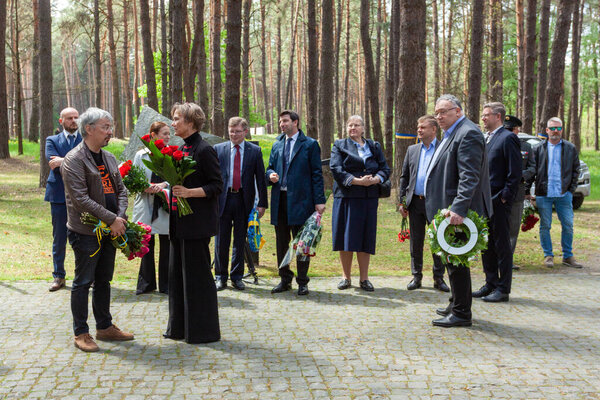 Bykivnia, Ukraine  May 15, 2022: The ceremony of Ukrainian and Polish delegations of honoring the memory of victims of Stalinist repressions at the Polish military cemetery in Bykovna near Kyiv.