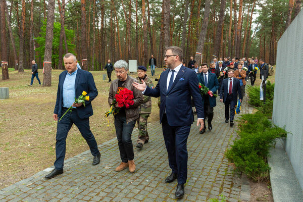 Bykivnia, Ukraine  May 15, 2022: The ceremony of Ukrainian and Polish delegations of honoring the memory of victims of Stalinist repressions at the Polish military cemetery in Bykovna near Kyiv.