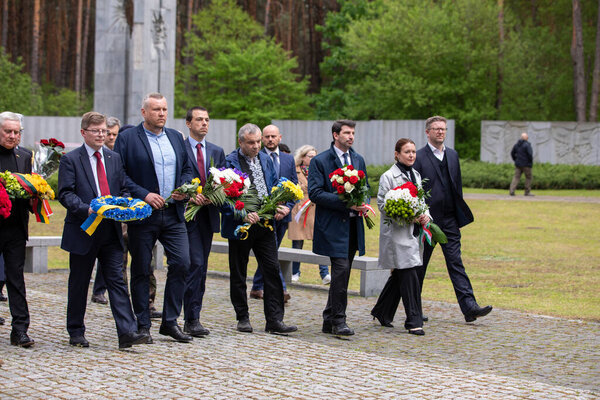 Bykivnia, Ukraine  May 15, 2022: The ceremony of Ukrainian and Polish delegations of honoring the memory of victims of Stalinist repressions at the Polish military cemetery in Bykovna near Kyiv.