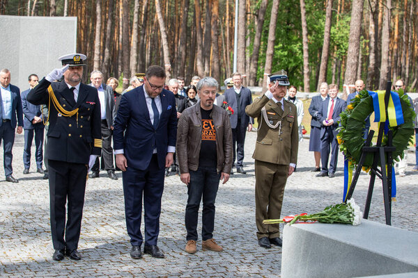 Bykivnia, Ukraine  May 15, 2022: The ceremony of Ukrainian and Polish delegations of honoring the memory of victims of Stalinist repressions at the Polish military cemetery in Bykovna near Kyiv.