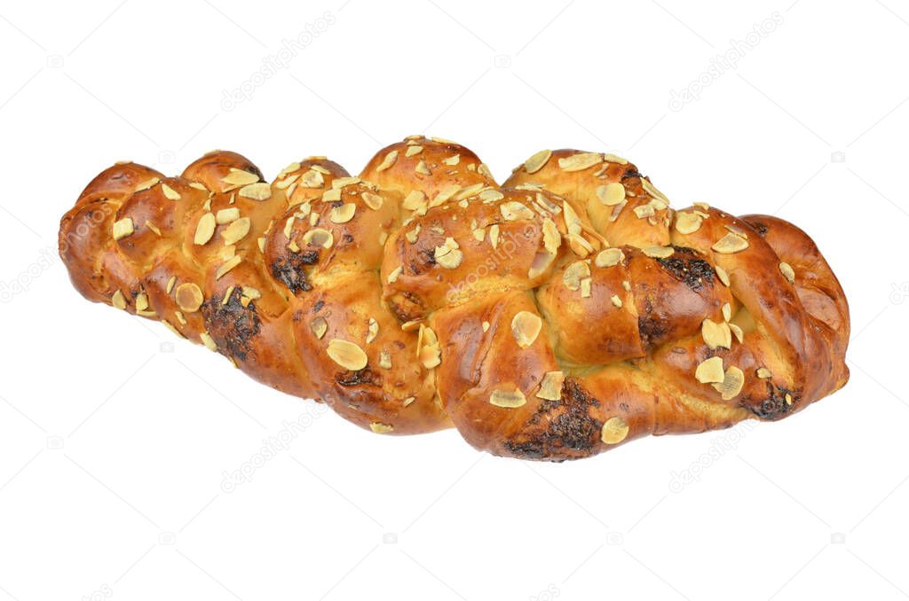 Fancy bread with raisins in slovak called: Vianocka. Sweet leavened bread slices with and one whole piece in the back. Easter bread. Isolated on white