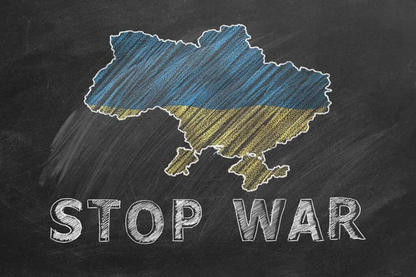 Map of Ukraine, national flag and lettering STOP WAR hand drawn with chalk on blackboard. Stand with Ukraine