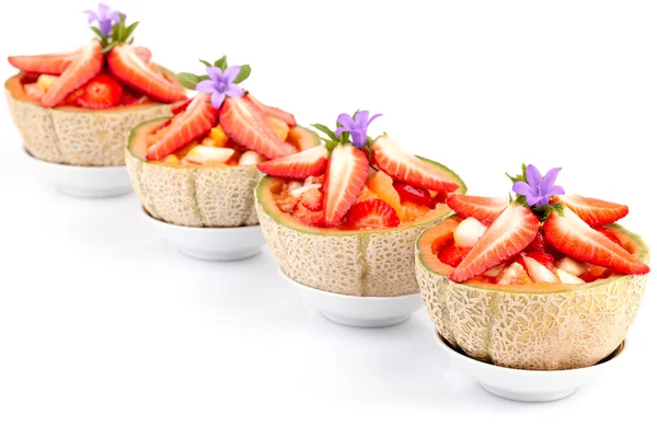 Salada de frutas em meio melão — Fotografia de Stock
