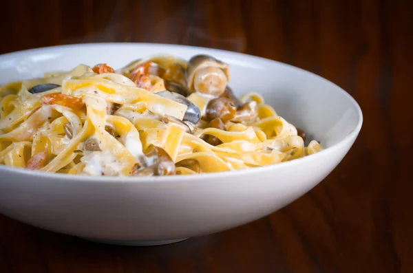 Plate of tasty Italian pasta Plate of tasty Italian pasta — Stock Photo, Image