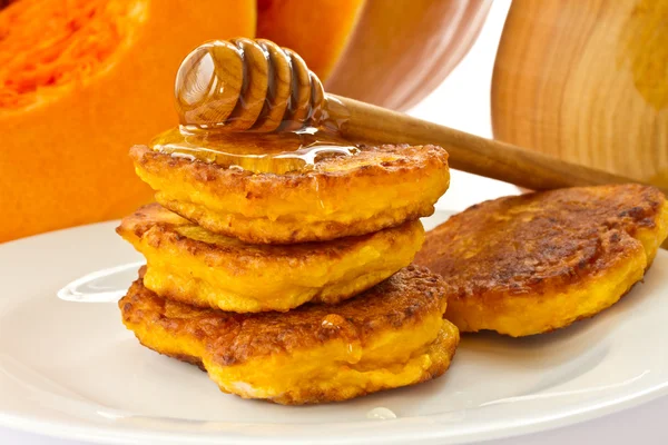 Pumpkin pancakes with honey — Stock Photo, Image
